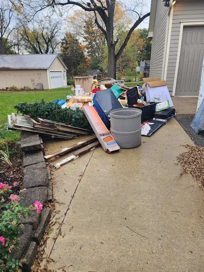 Dumpster being loaded with debris for 30 Yard Dumpster Rental in Massena